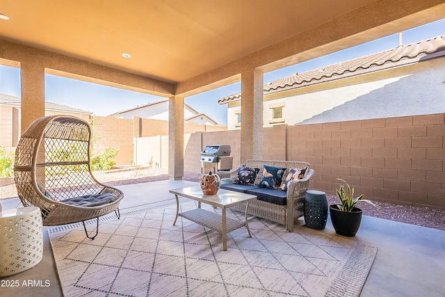 view of patio featuring a grill and an outdoor living space