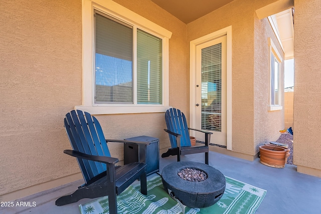 view of patio with an outdoor fire pit