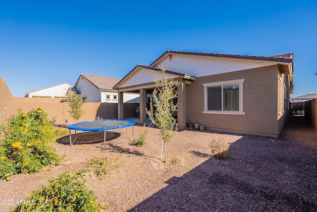 back of property with a trampoline