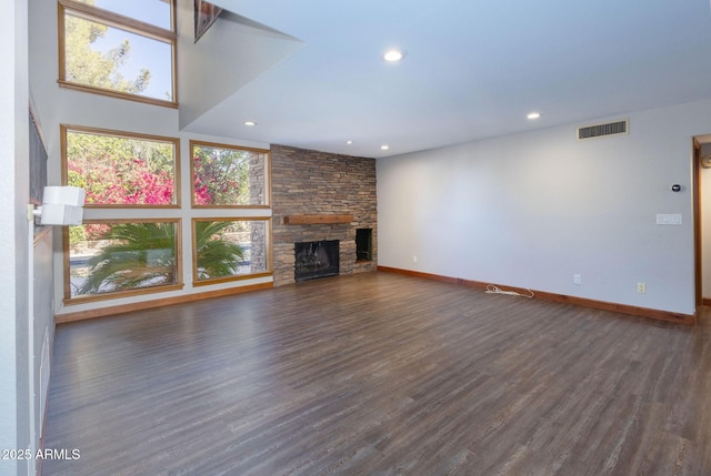 unfurnished living room with dark hardwood / wood-style flooring and a fireplace