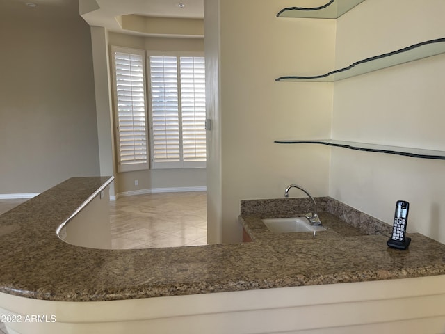 bathroom with tile patterned flooring and sink