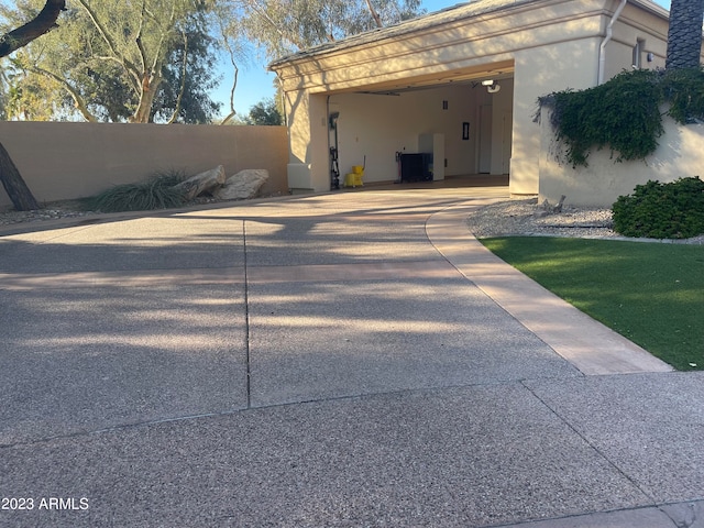 view of side of home with a carport