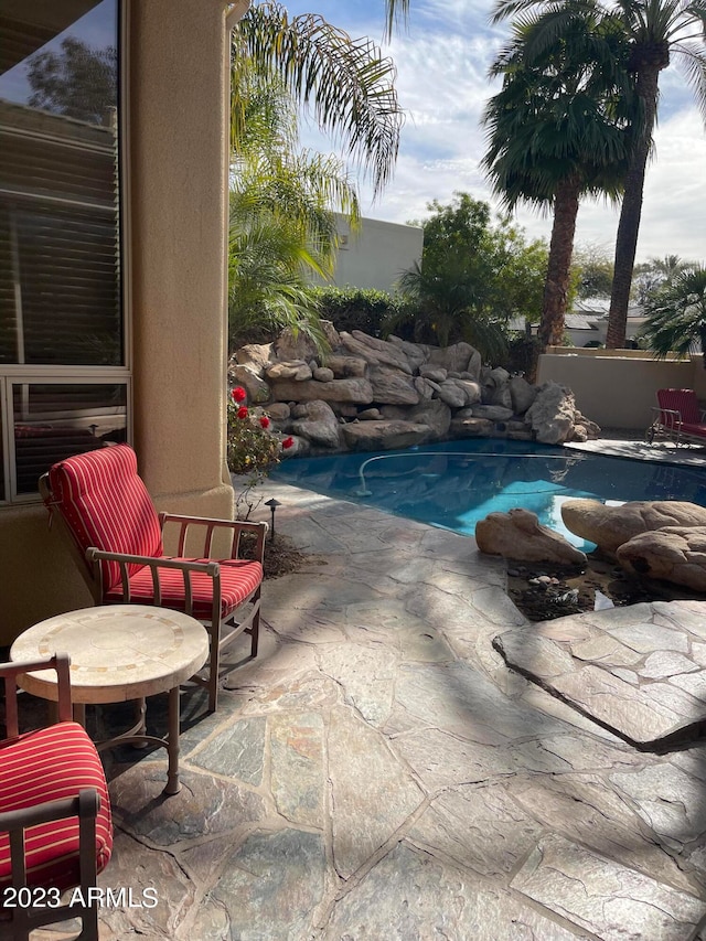 view of pool featuring a patio area