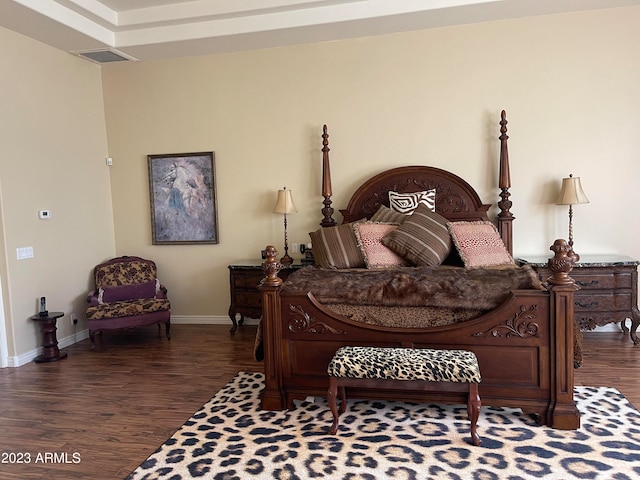 bedroom featuring dark hardwood / wood-style flooring