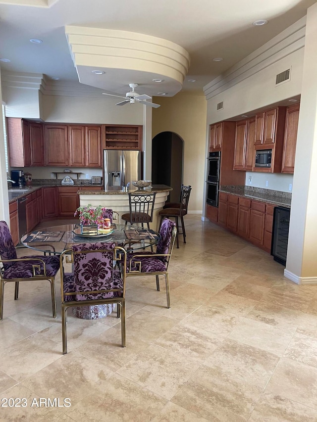 kitchen featuring ceiling fan and stainless steel appliances