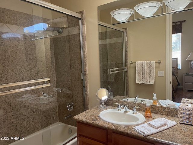 bathroom with vanity and enclosed tub / shower combo
