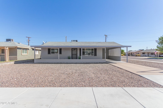 ranch-style home with a carport