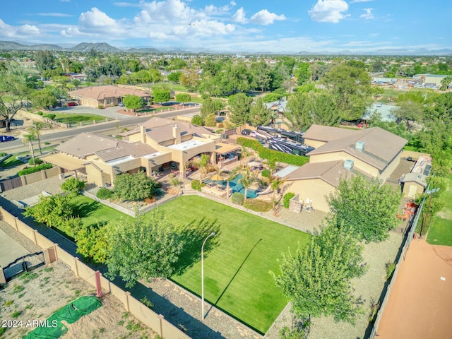 birds eye view of property with a residential view