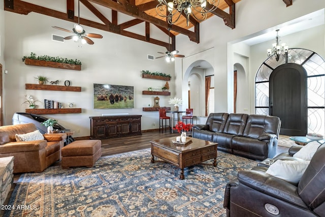 living room with arched walkways, high vaulted ceiling, visible vents, and ceiling fan with notable chandelier