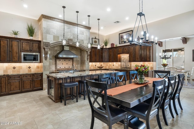 dining space with light tile patterned floors, visible vents, recessed lighting, and a chandelier