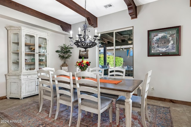 dining space featuring a notable chandelier, beamed ceiling, visible vents, and baseboards