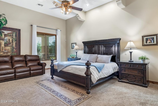 carpeted bedroom featuring visible vents, baseboards, and ceiling fan