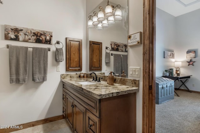 bathroom featuring baseboards and vanity