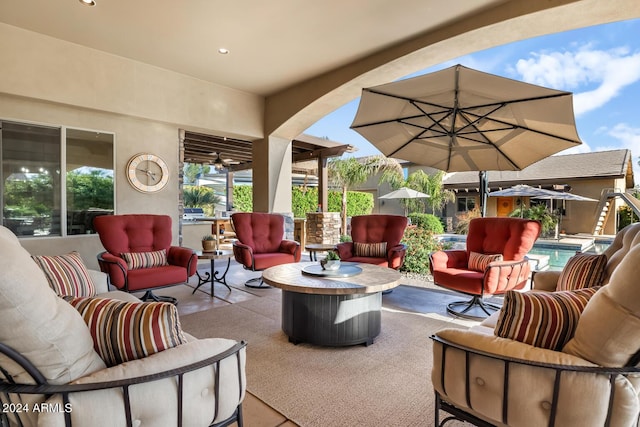 view of patio / terrace featuring an outdoor living space and an outdoor pool