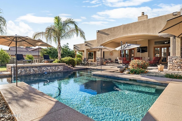 outdoor pool with a patio area