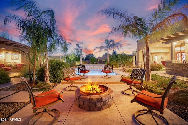 view of patio / terrace with an outdoor fire pit