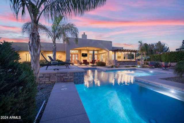 pool featuring french doors, a patio, and a jacuzzi
