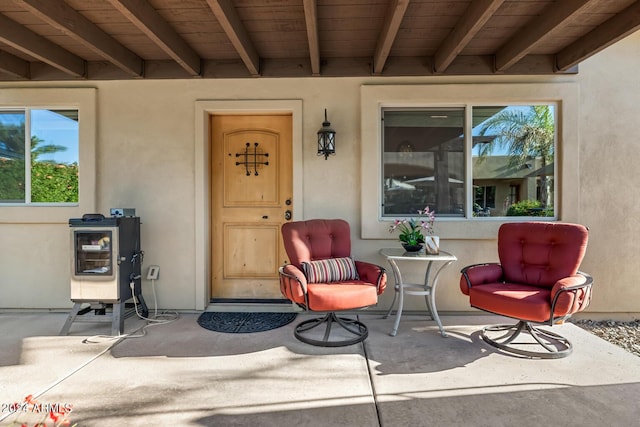 view of exterior entry with stucco siding