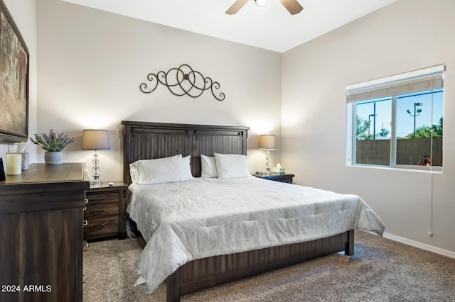 bedroom with carpet floors, a ceiling fan, and baseboards