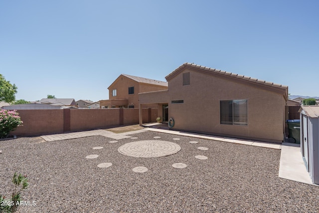 10618 W Pima St, Tolleson, AZ 85353 - back of property featuring stucco siding and a tile roof
