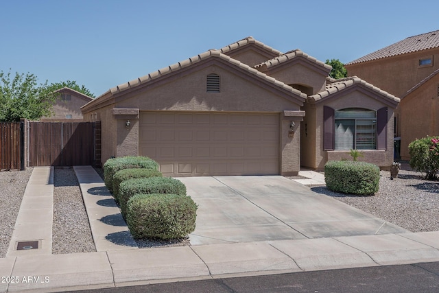 10618 W Pima St, Tolleson, AZ 85353 - view of front of house with driveway, a garage, stucco siding, and a tiled roof