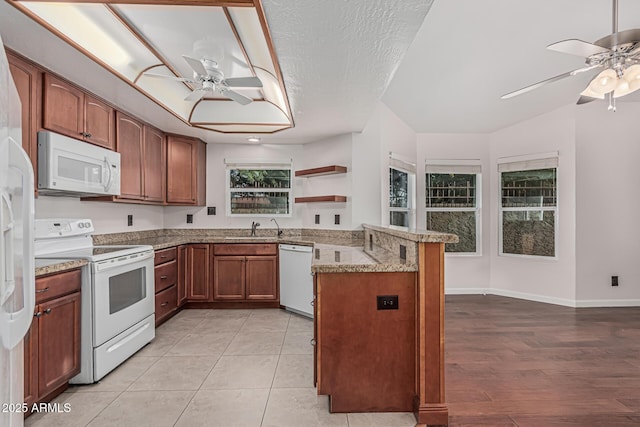 kitchen with white appliances, open shelves, a ceiling fan, a peninsula, and baseboards