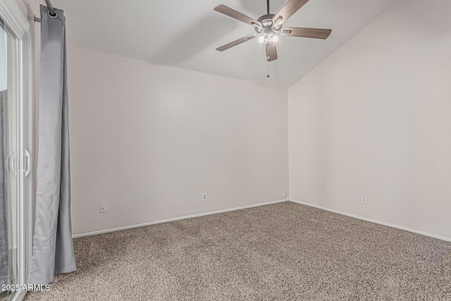 carpeted empty room featuring a ceiling fan and baseboards