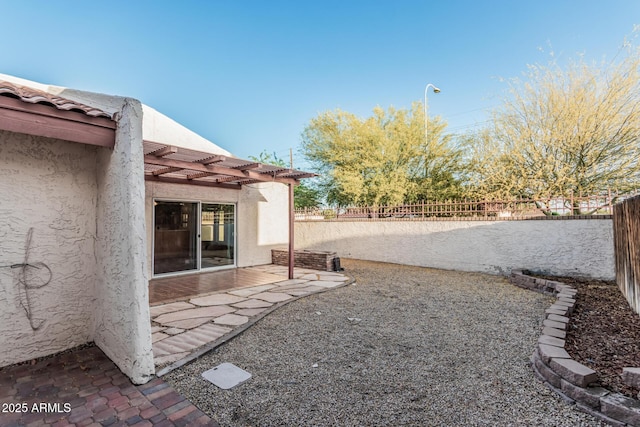 view of yard featuring a fenced backyard, a patio area, and a pergola
