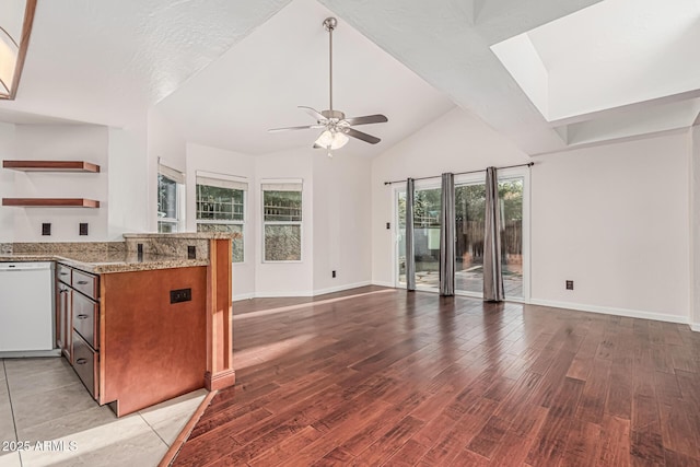 kitchen featuring light wood-style flooring, brown cabinetry, open shelves, white dishwasher, and ceiling fan