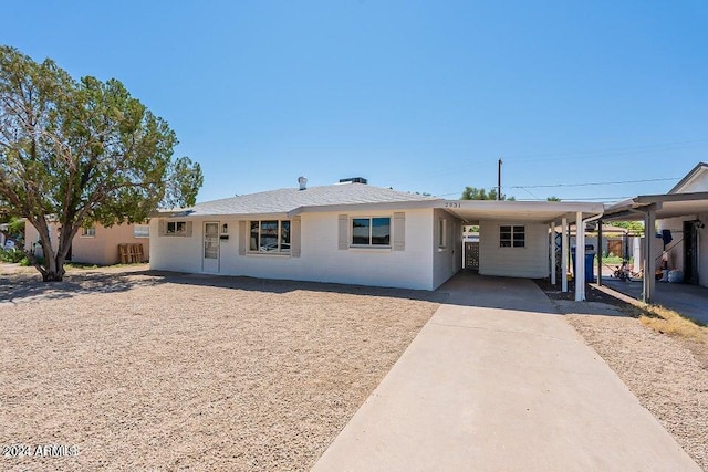 view of front of home featuring a carport