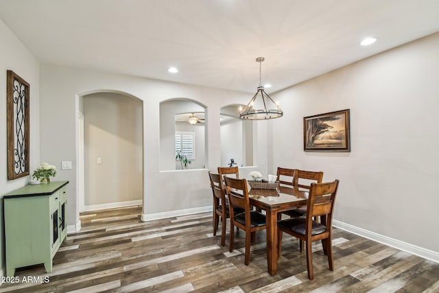 dining room featuring dark hardwood / wood-style floors and a chandelier