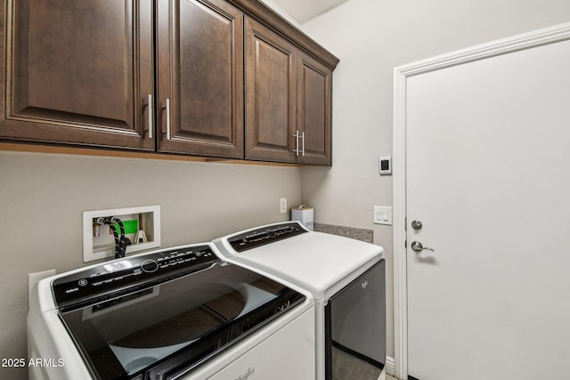 laundry area featuring cabinets and separate washer and dryer