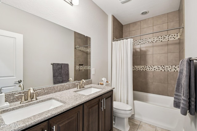 full bathroom featuring shower / tub combo, vanity, tile patterned floors, and toilet