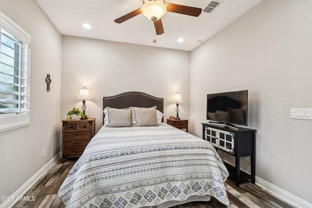 bedroom featuring dark hardwood / wood-style floors and ceiling fan