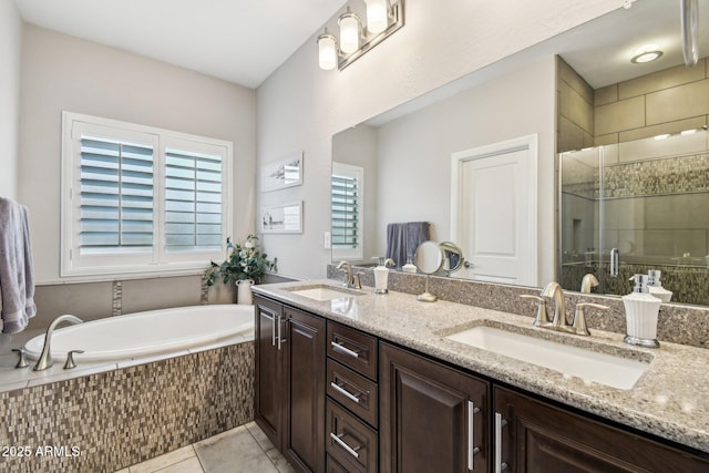 bathroom with independent shower and bath, vanity, and tile patterned floors