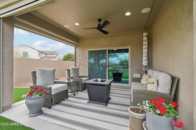 view of patio featuring ceiling fan and outdoor lounge area