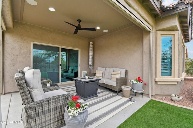 view of patio featuring ceiling fan and an outdoor living space