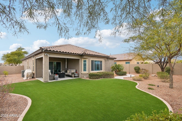 back of house with an outdoor living space, a yard, and a patio