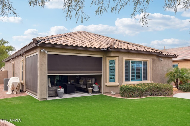 back of property featuring a yard and an outdoor hangout area