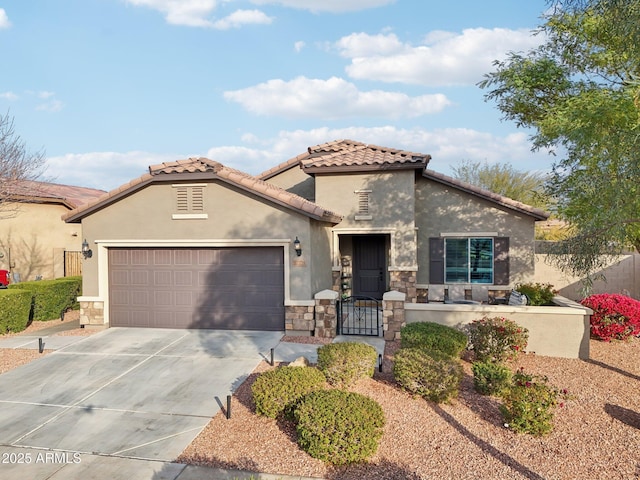 mediterranean / spanish house featuring a garage