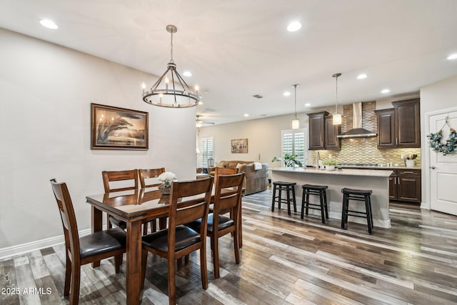 dining space featuring dark hardwood / wood-style floors and ceiling fan