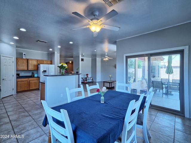 dining room featuring ceiling fan and light tile patterned floors