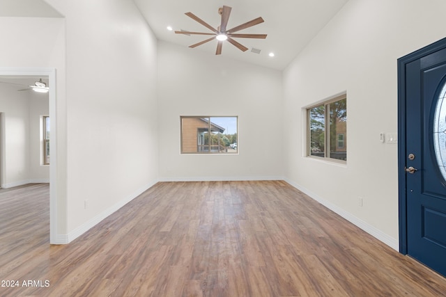 entryway featuring ceiling fan, high vaulted ceiling, and light hardwood / wood-style floors