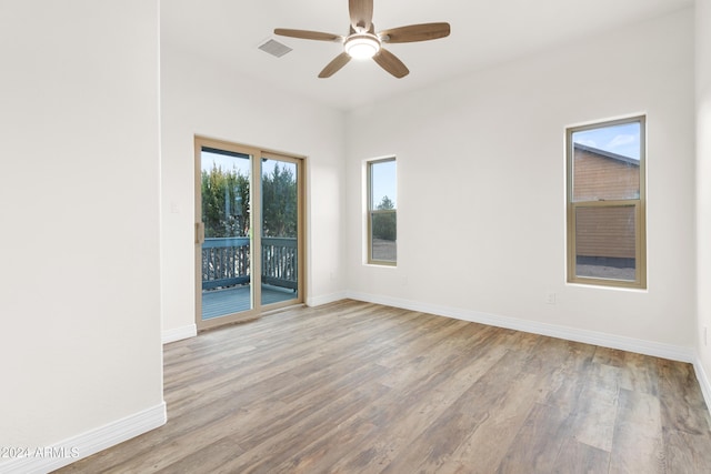 spare room with ceiling fan and light hardwood / wood-style flooring