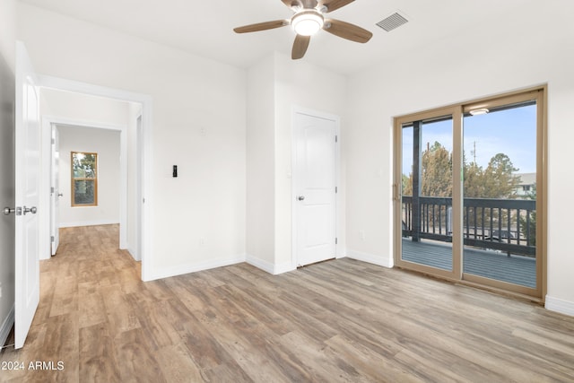 unfurnished room featuring ceiling fan and light hardwood / wood-style floors