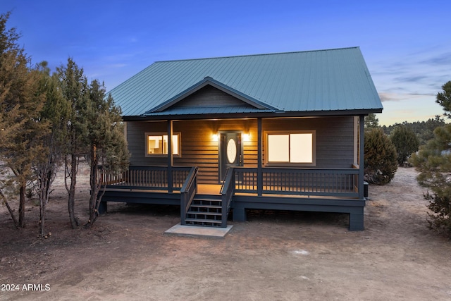 view of front of property featuring a wooden deck