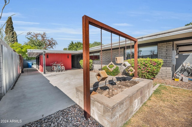 view of patio featuring an outdoor fire pit