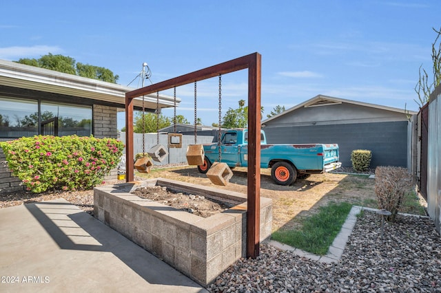 view of patio / terrace featuring a shed