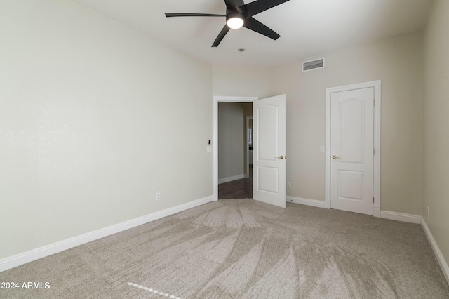 unfurnished bedroom featuring carpet flooring and ceiling fan