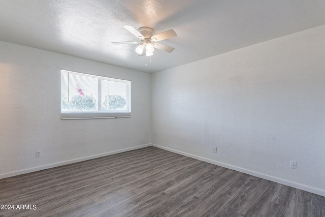 3115 N 55th Ave, Phoenix, AZ 85031 - spare room featuring dark wood-style flooring and a ceiling fan